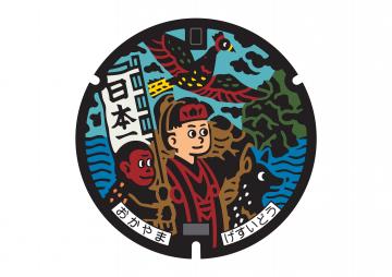 桃太郎がデザインされたマンホールのふたの画像