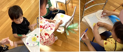 飾りに色付けをする子どもたち