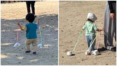 両手にペットを連れている子どもたち